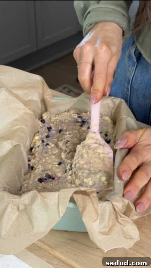 Gluten-free blueberry bread batter with streusel topping before baking.