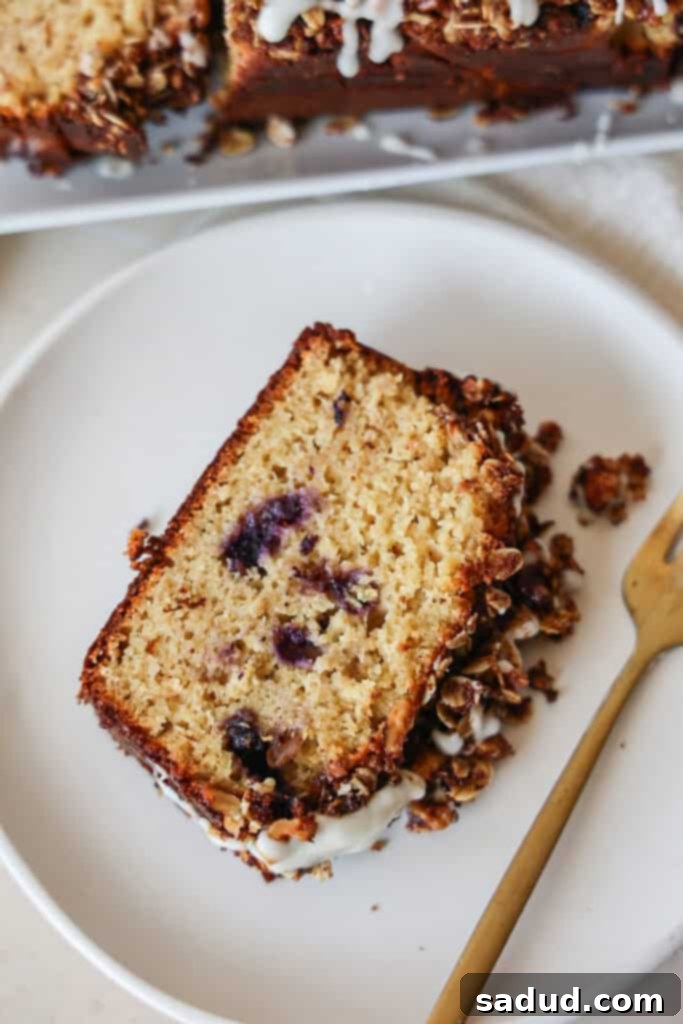 Gluten-Free Quick Blueberry Bread 6 Gluten-free blueberry bread with streusel/crumb topping and lemon glaze, sliced.