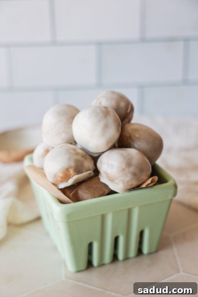 A bowl of healthy, vegan donut holes with glaze, ready to be enjoyed as a nourishing snack or treat.