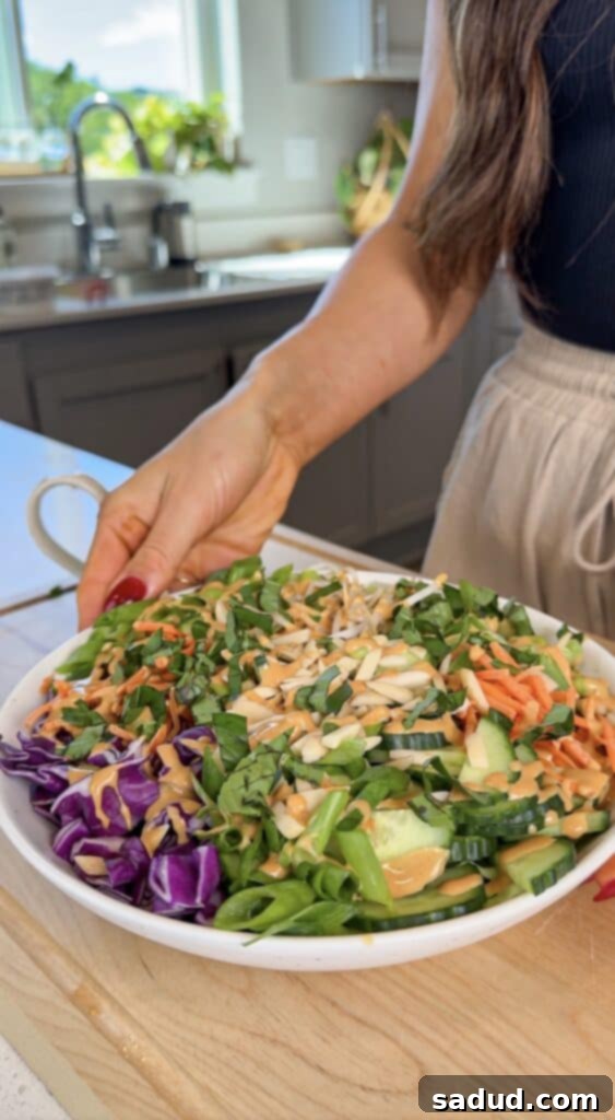 Fresh Thai Peanut Crunch 3 Thai chopped salad with peanut butter sesame dressing, showing a close-up of the mixed ingredients.