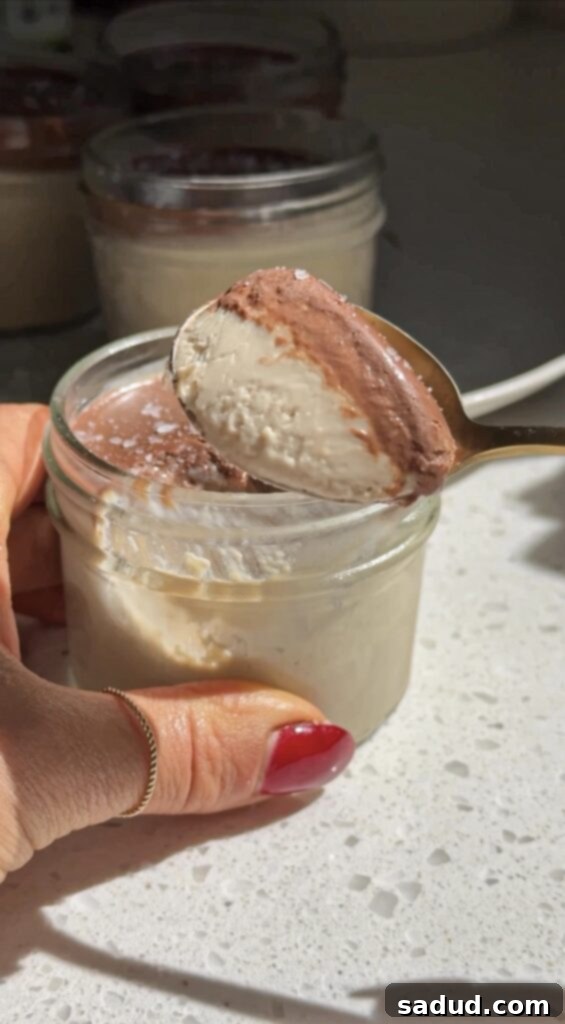 Guilt-Free Vegan Tiramisu Pudding Cups 4 A single jar of healthy vegan tiramisu, showcasing the layers of pudding, ganache, and sea salt.
