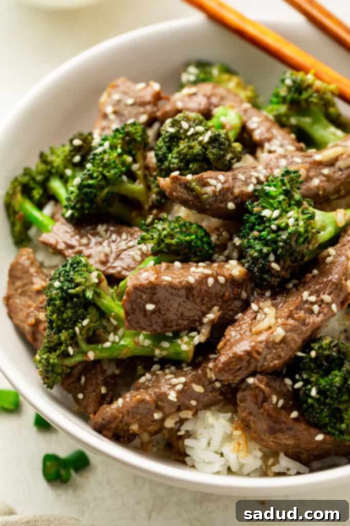 Beef with garlic sauce in a bowl with chopsticks