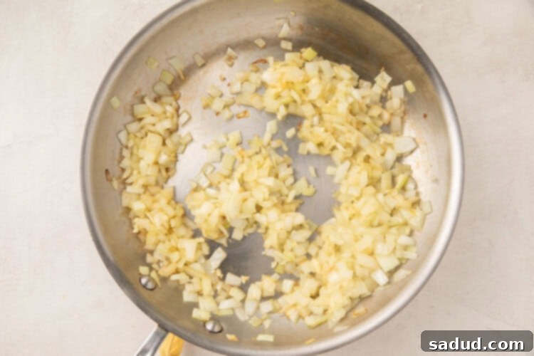 Garlic and sesame oil sizzling in a large skillet