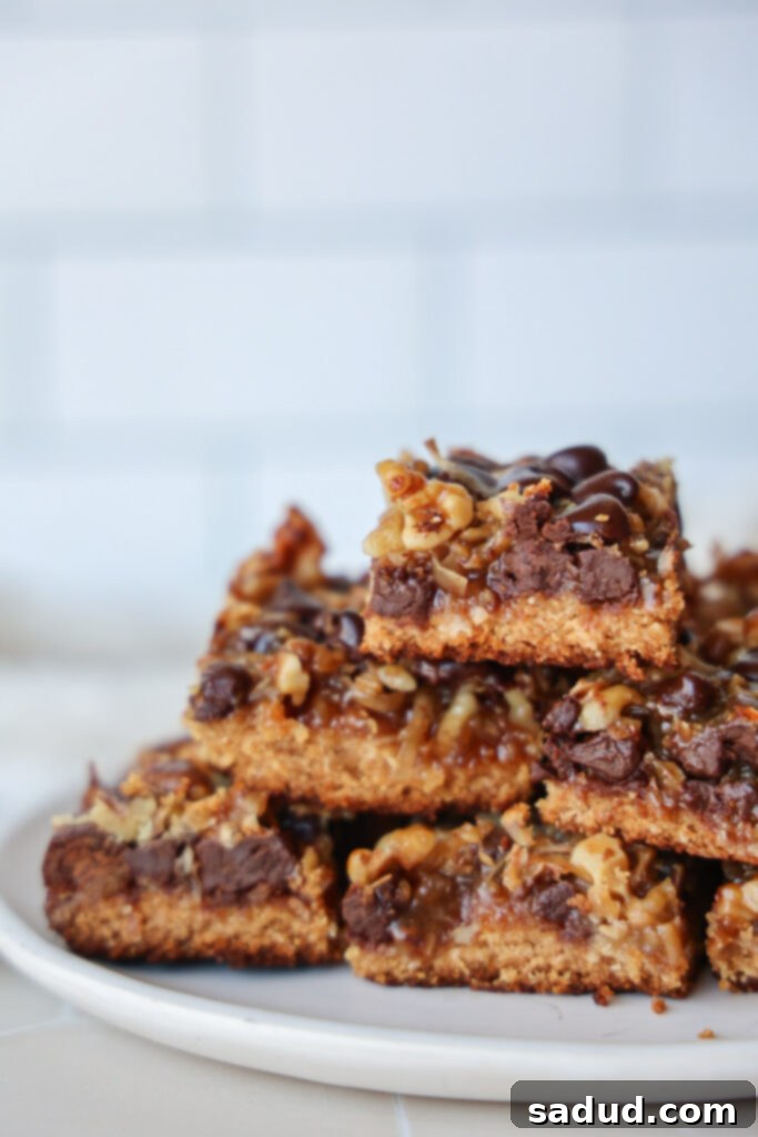 Delicious and healthy Magic Cookie Bars, also known as 7 Layer Bars or Hello Dollies, made with paleo, gluten-free, and vegan ingredients.