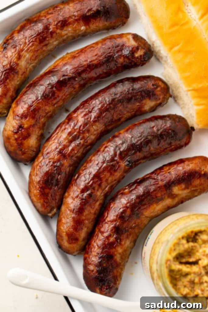 5 Italian sausages on a platter, ready to be served
