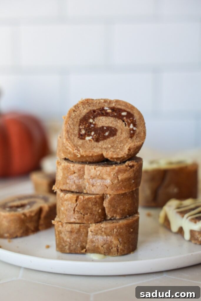 Delicious raw vegan cinnamon rolls ready to eat, garnished with a sprinkle of cinnamon.