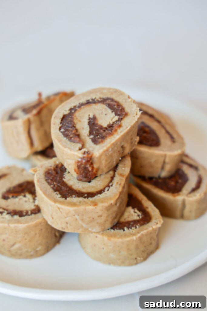 Close-up of Erewhon raw vegan no bake cinnamon rolls showing their dense, dough-like texture and rich filling.