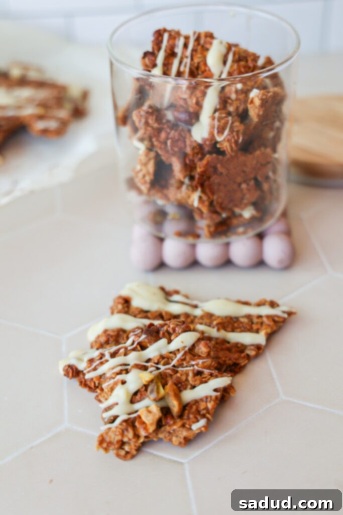 Baklava Granola Clusters 4 An easy and healthy Baklava granola recipe spread on a baking sheet, ready for the oven.