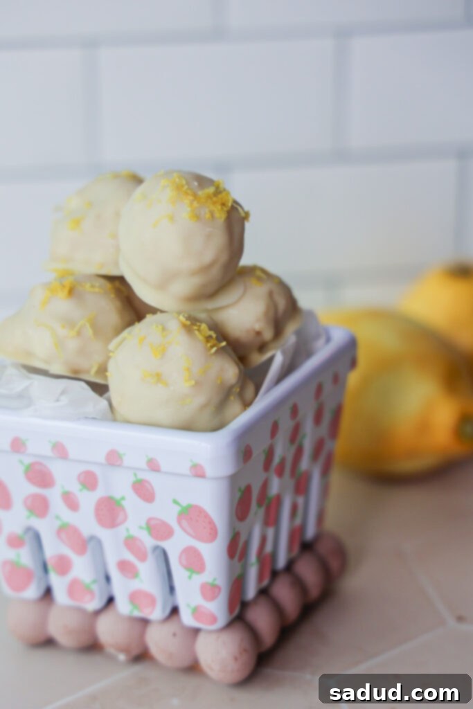 A bowl of vegan lemon balls/truffles, showcasing their soft, doughy texture before coating.
