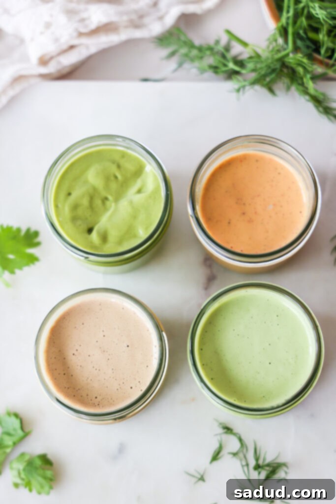 4 healthy homemade salad dressings - Peanut butter dressing, tahini sauce, cilantro lime salad dressing, sweet and spicy tahini dressing. A close-up shot of the four dressings.