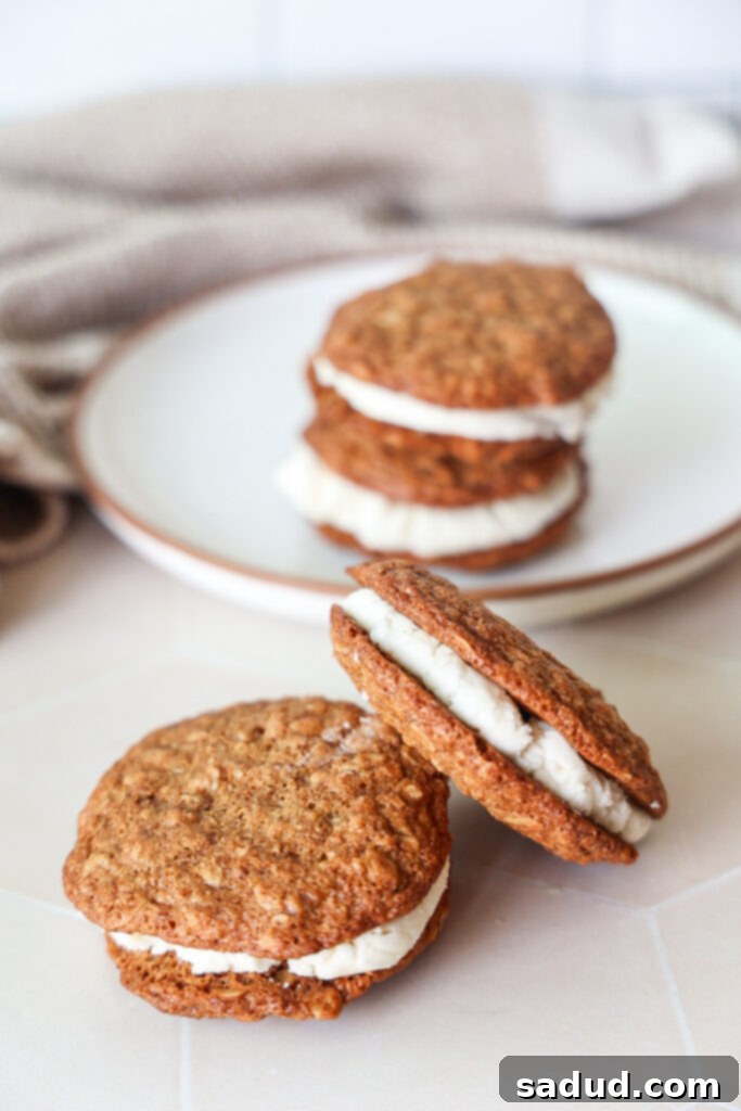 A plate featuring a stack of three homemade gluten-free oatmeal creme pies, ready to be enjoyed.
