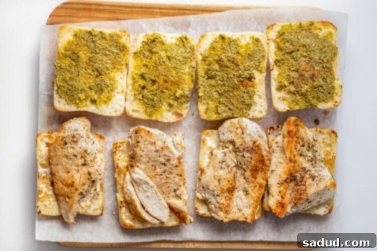 Chicken cutlets added to toasted ciabatta rolls with mayo.