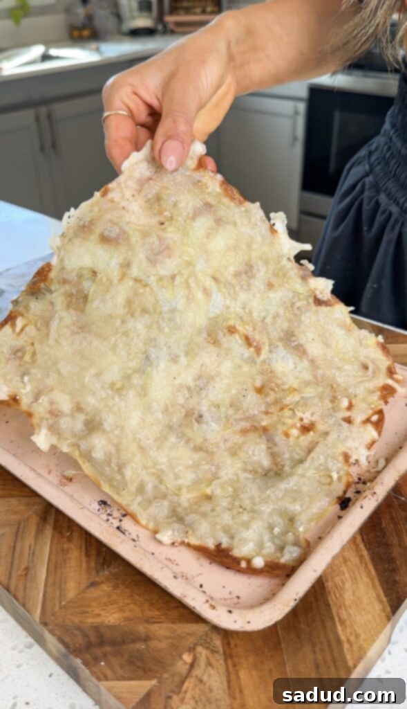 Potato crust baking in the oven, showing golden edges.
