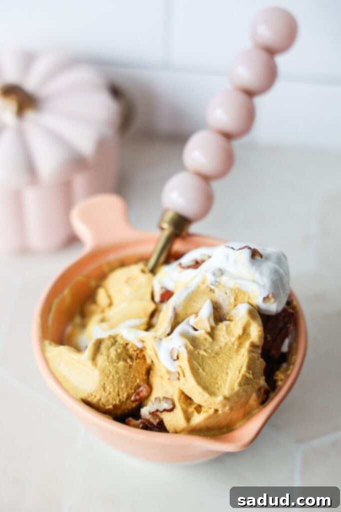 A close-up of incredibly creamy pumpkin ice cream with a smooth texture.