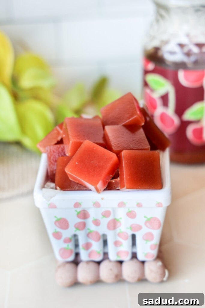 A bowl of vibrant, red tart cherry sleep gummies, ready to be enjoyed.