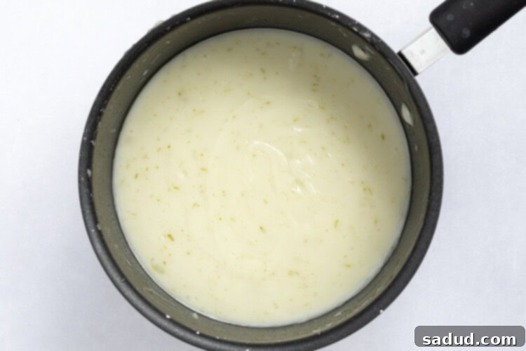 Vegan Key Lime Pie Filling cooking in a saucepan.