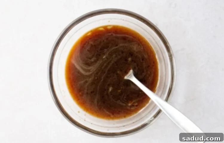 Pad Thai sauce in a small glass mixing bowl