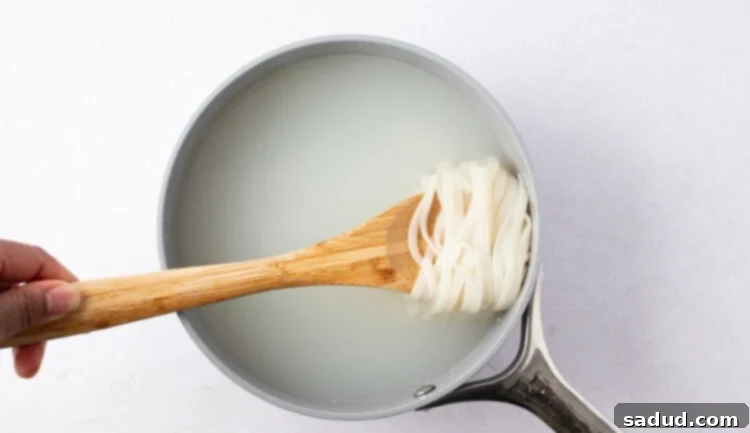 Pad Thai noodles in a saucepan