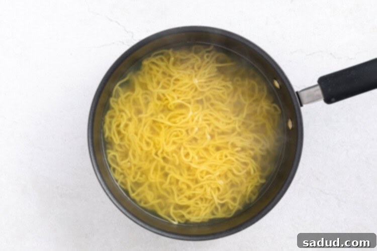 Ramen noodles being strained after cooking