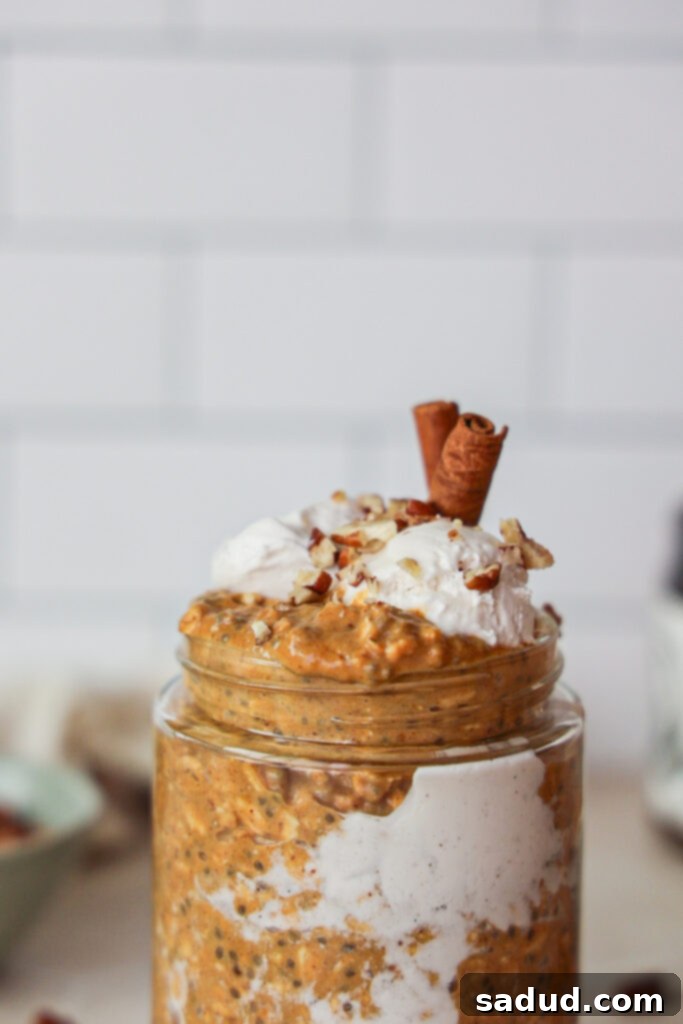 Creamy pumpkin overnight oats with chia seeds, cinnamon, and yogurt.
