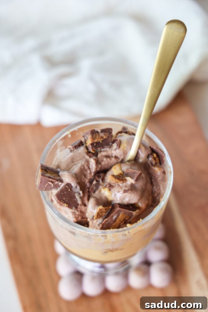 The blended ice cream base poured into a Ninja Creami pint, ready for freezing.