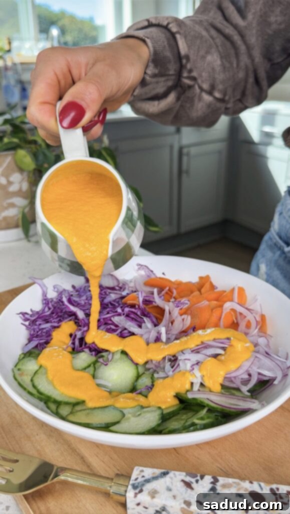 Vibrant Japanese Carrot Ginger Dressing 3 Freshly blended Japanese carrot ginger salad dressing in a glass jar.
