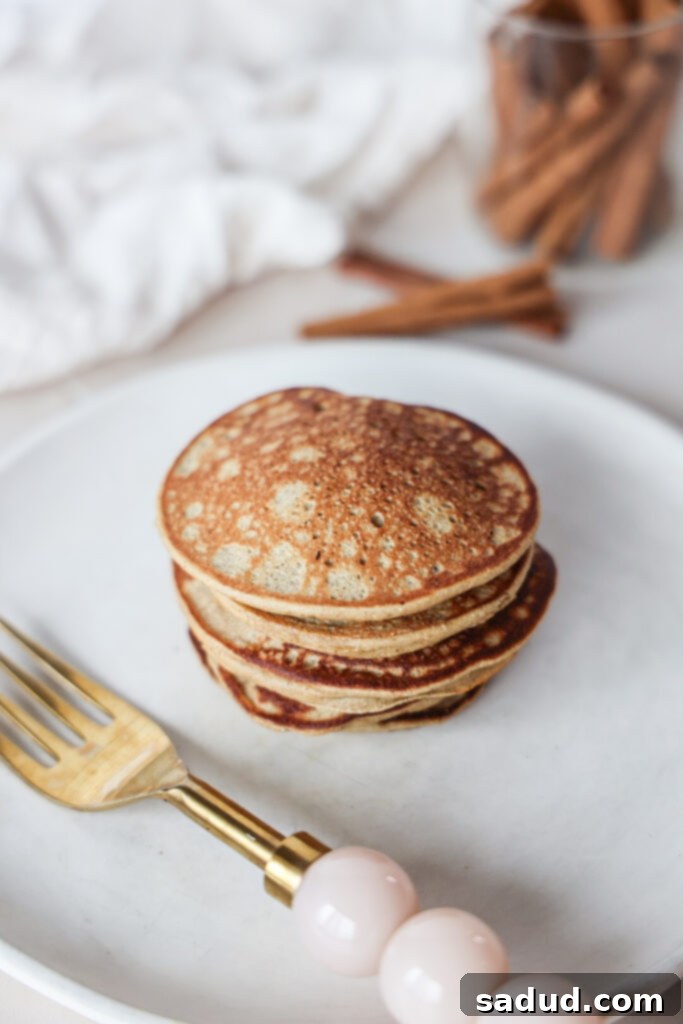 Ultimate Gluten-Free Protein Pancakes Vegan Friendly 2 Fluffy homemade protein pancakes stacked high with fresh fruit.