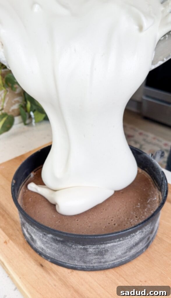 Paleo marshmallow fluff on a S'mores tart, ready for serving.