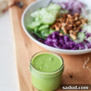 Vibrant Vegan Green Goddess Dressing 6 Vegan Green Goddess Dressing on a salad.