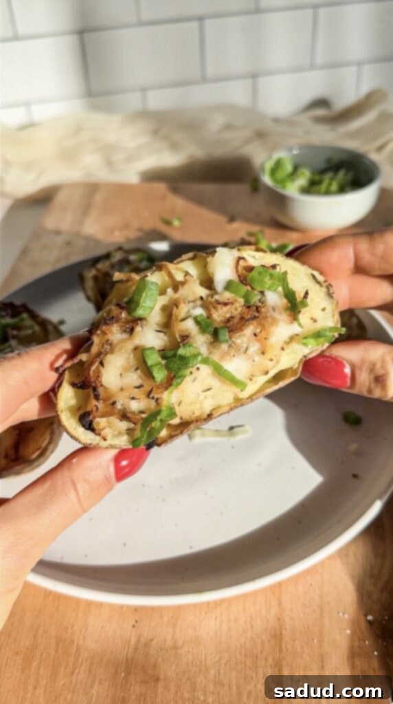 Gluten & dairy-free French onion twice baked potatoes, garnished with chives.