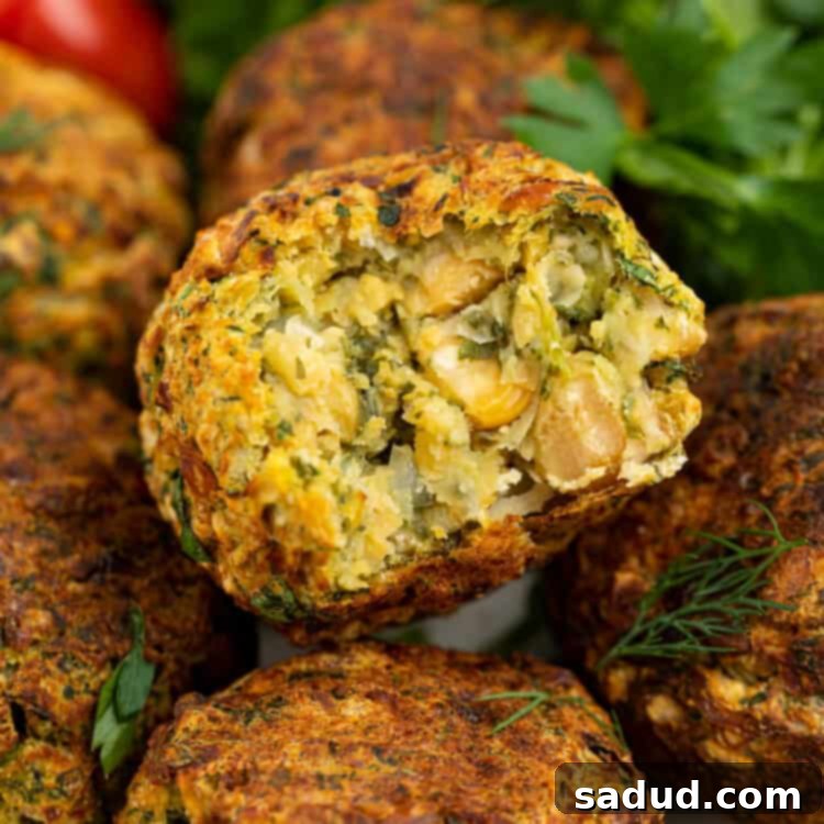 close up image of air fryer falafel with a bite removed