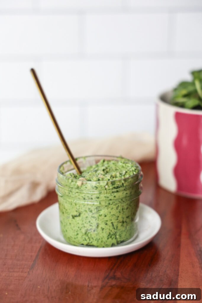 Homemade Superfood pesto – a vibrant green, creamy spread in a glass jar, ready to be enjoyed.