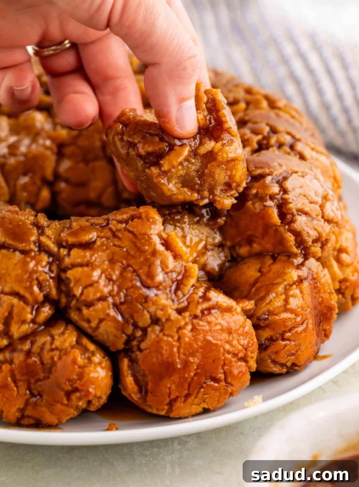 hand removing a piece of gluten-free monkey bread.